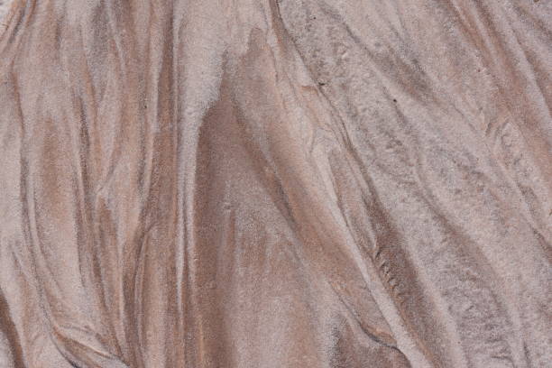 istock Beige and brown hues in eroded sand with V shape 1220147232