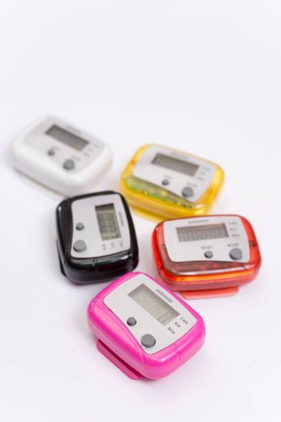 istock Colorful pedometers over white background 1220147255
