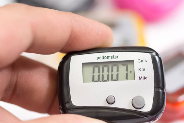 Pedometer in the hand stock photo