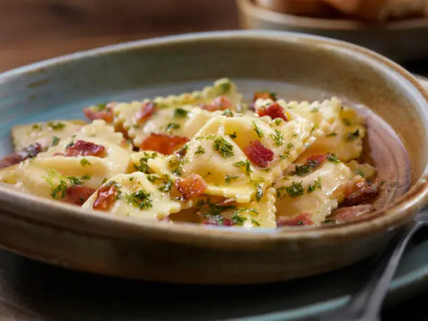 Butter Poached Lobster Ravioli with Bacon and Fresh Parsley