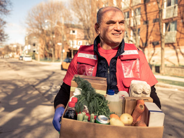 istock COVID-19, Donation Home food delivery during lockdown 1220149763