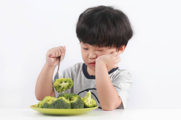 Kid Refuses Vegetables stock photo
