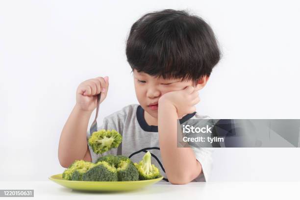 Kid Refuses Vegetables Stock Photo - Download Image Now - Child, Vegetable, Eating
