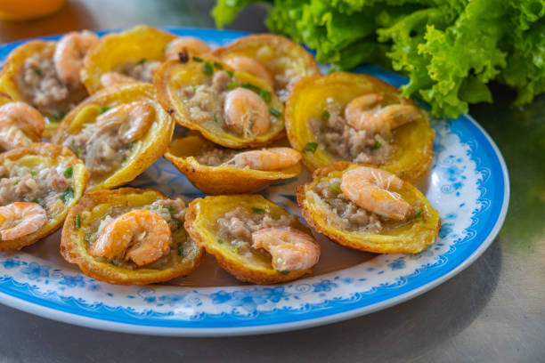 istock Banh Khot- Vietnamese tiny prawn pancake served with vegetables 1220150741