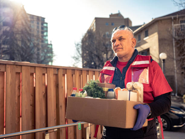 istock COVID-19, Donation Home food delivery during lockdown 1220150823