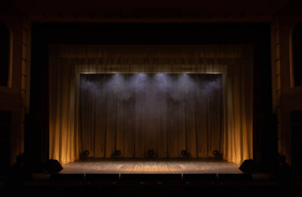 istock Theater lights spotlights and smoke over the stage 1220151214