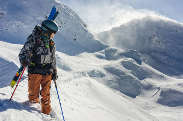 istock Free ride skier on a mountain ridge on a beautiful sunny winter day 1220151572