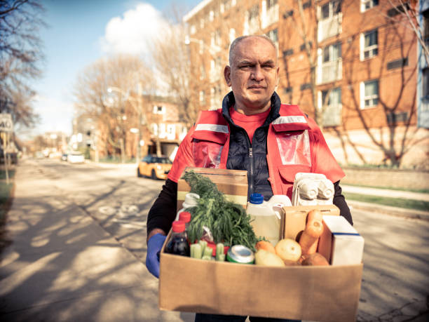 istock COVID-19, Donation Home food delivery during lockdown 1220151676