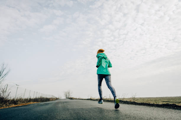 istock Sporty woman during jogging 1220151759