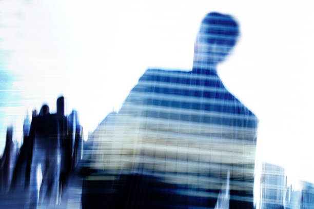 istock Blurred businessman and commuters superimposed with office buildings. 1220151783