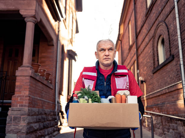 istock COVID-19, Donation Home food delivery during lockdown 1220151786