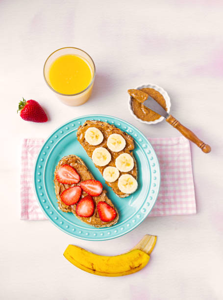 istock Whole grain toast with almond butter and fruit 1220152541