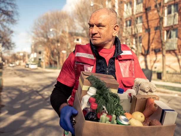 istock COVID-19, Donation Home food delivery during lockdown 1220153066