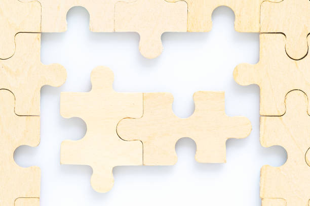 istock wooden jigsaw puzzle pieces on white background 1220153492