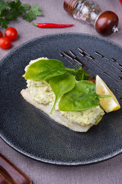 istock Cooked white fish fillet served with grilled zucchini 1220153700