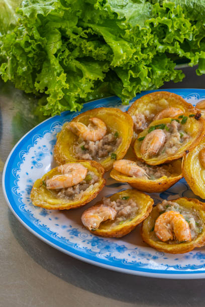 istock Vietnamese cuisine, Banh Khot- tiny sizzling fried shrimp pancake 1220154277