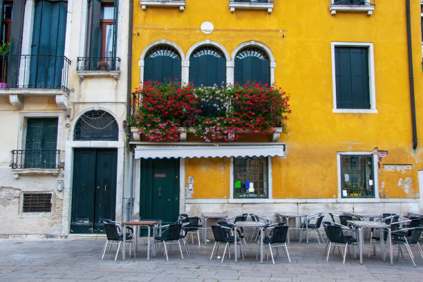 istock Empty Tables Of Sidewalk Cafe, Venice, Italy 1220154307
