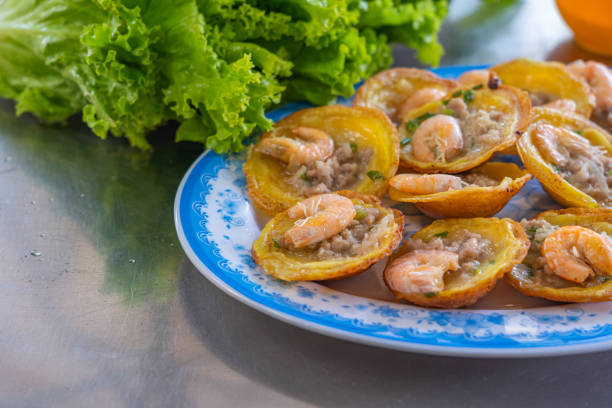 istock Banh Khot- Vietnamese tiny shrimp pancake served with vegetables 1220154352
