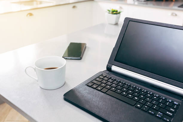 istock Teleworking place for a freelancer with her tablet and mobile phone 1220154575