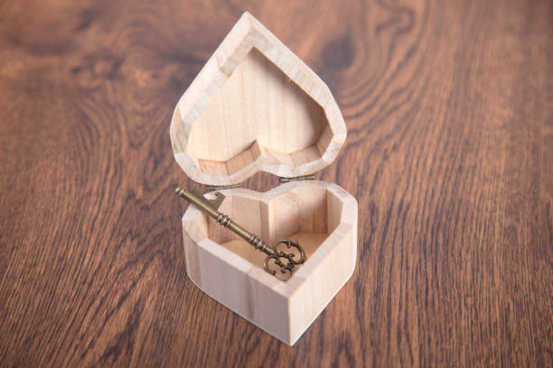 house key on wooden heart house key on wooden heart on the table 2667 stock pictures, royalty-free photos & images