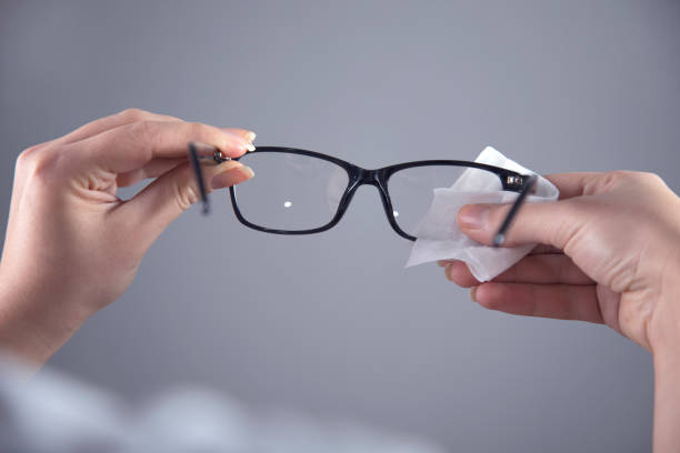 istock woman cleaning glasses 1220154770
