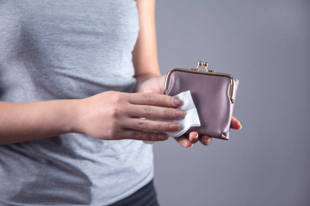 istock woman  cleaning wallet 1220154781