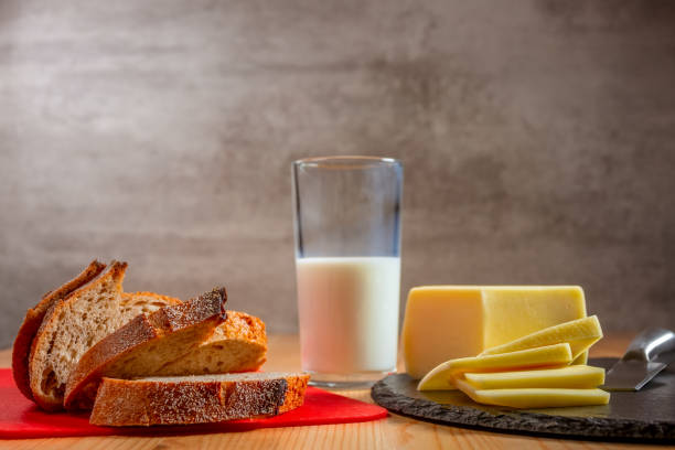istock Fresh Bread, Cheese and a Glass of Milk 1220155918