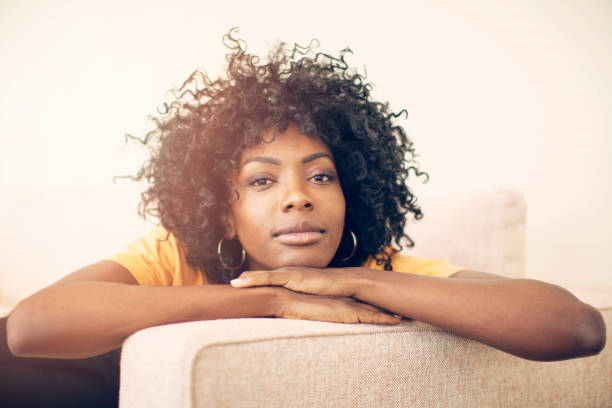 istock Young pensive woman relaxing at home 1220156694