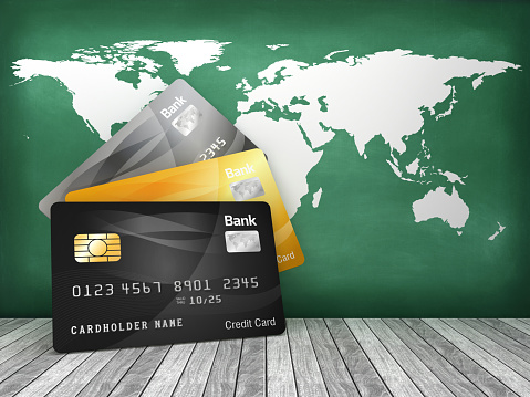 Credit Cards with World Map on Chalkboard - 3D Rendering