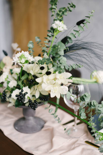 istock Table setting at a luxury wedding and Beautiful flowers in a vase on the table. 1220159609
