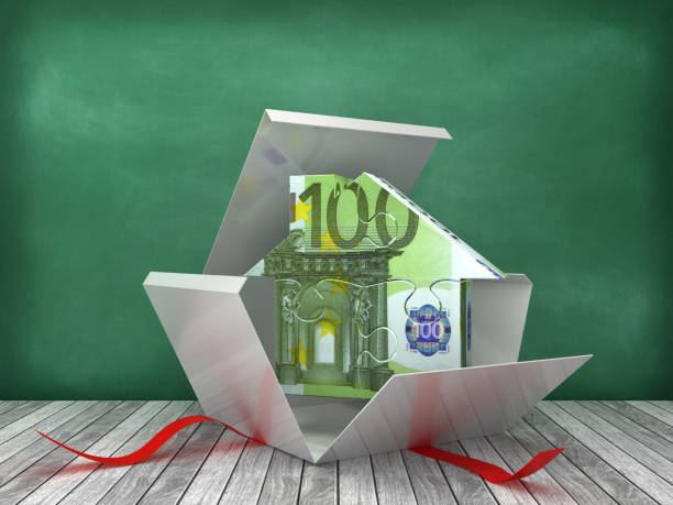 istock Gift Box with Euro Puzzle House on Chalkboard Background - 3D Rendering 1220160893