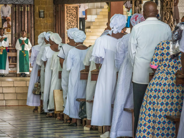 woman dressed in the typical costume of prayer in the St. Michael Nkembo church in the African city of Libreville in Gabon