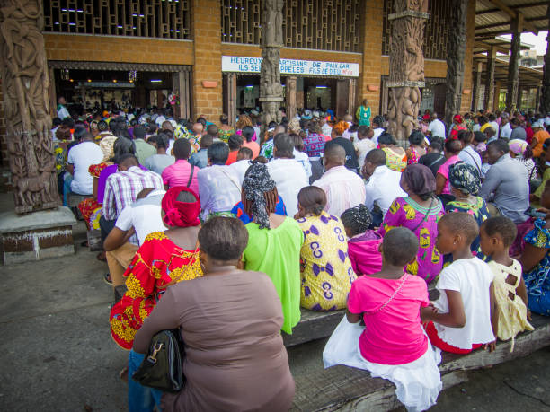 Group of people celebrating a religious event in the St. Michael Nkembo church in the African town of Libreville in Gabon