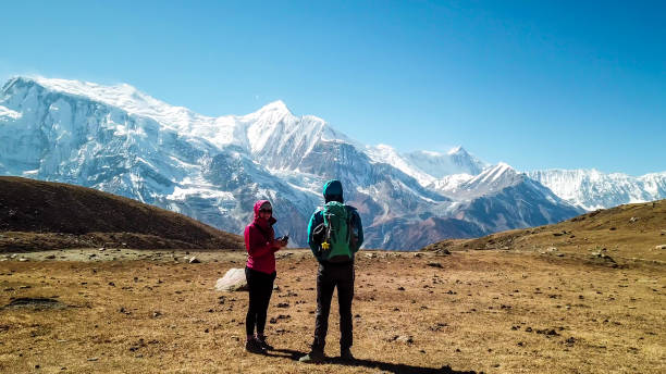 istock Ice Lake - A couple walking along a pathway with the view on Annapurna Chain 1220163561