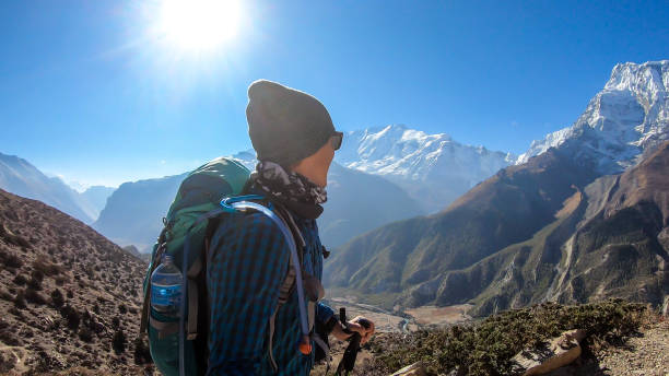 istock Ice Lake - A man hiking with Annapurna chain behind him 1220163777