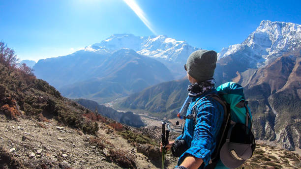 istock Ice Lake - A man hiking with Annapurna chain behind him 1220163798