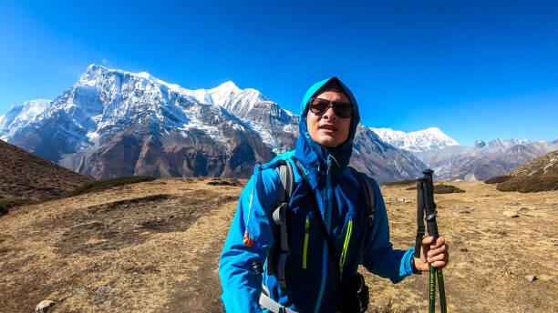 istock Ice Lake - A man hiking with Annapurna chain behind him 1220163806