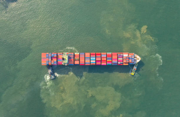 istock Container , container ship in export and import business and logistics. Shipping cargo to harbor by crane. Water transport International. Aerial view and top view. 1220165293