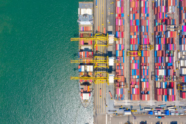 istock Container , container ship in export and import business and logistics. Shipping cargo to harbor by crane. Water transport International. Aerial view and top view. 1220165297