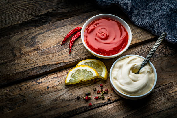 istock Ketchup and mayonnaise on rustic wooden table 1220165344