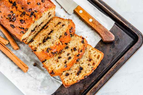 istock Banana Bread with Chocolate Chips, Bread Slices on Baking Sheet, Directly Above Horizontal Photo 1220165590