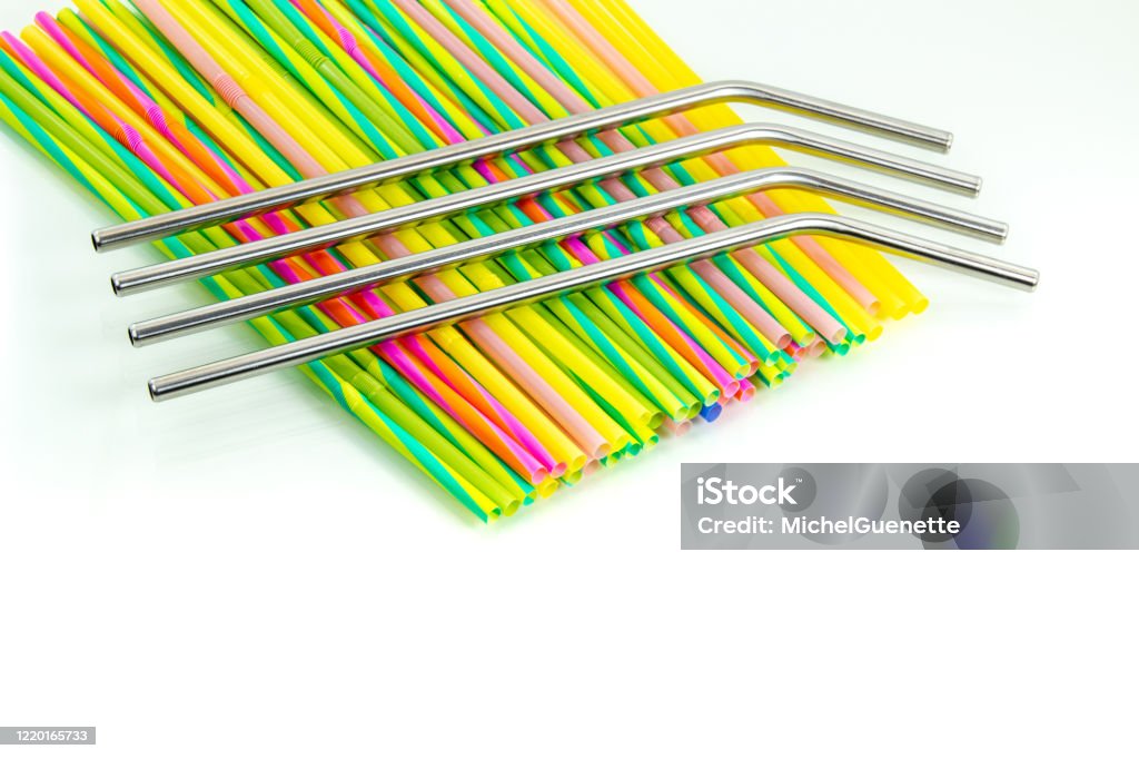 Reusable Stainless Steel Straws Above Disposable Plastic Straws On A White  Background Stock Photo - Download Image Now - iStock