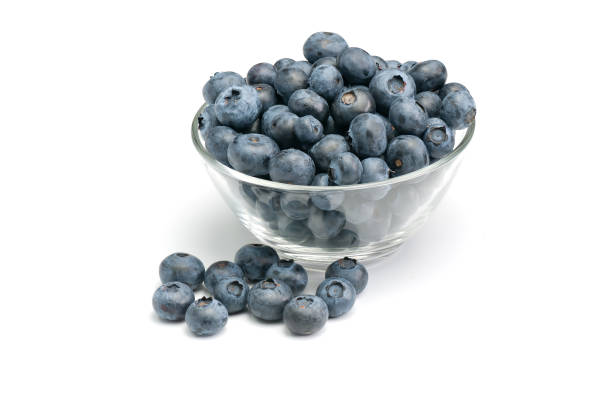istock Fresh wild blueberries in glass bowl. 1220166480