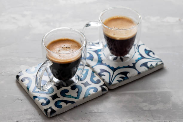 istock two cups of coffee on ceramic background 1220167114