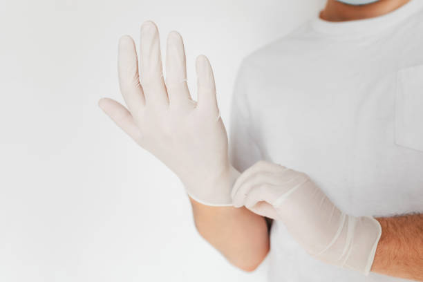 istock Putting on medical protective gloves 1220167836
