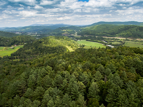 Looking down on the farms of the Passumpsic River valley, to the north with the town of St. Johnsbury in the distance