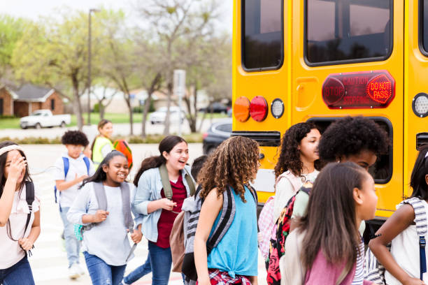 istock Schoolchildren prepare to board school bus 1220169248