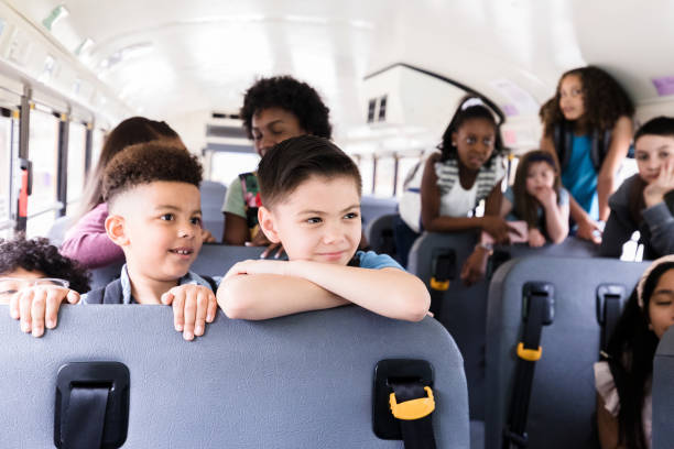 istock Children stand up while waiting to get off school bus 1220169367