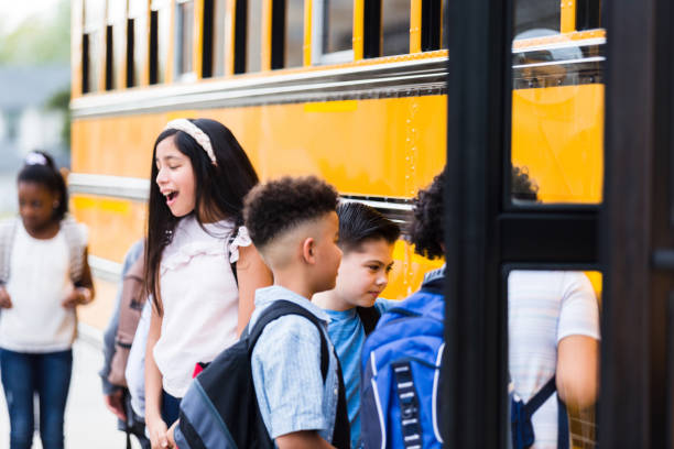 istock Schoolchildren board school bus 1220169542