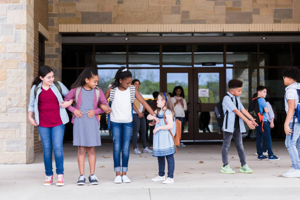 istock School children leave school building 1220169563